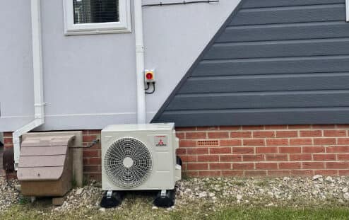 Home air conditioning outdoor unit on a ground stand, Newcastle Home air conditioning outdoor unit on a ground stand fitted by UK Aircon, air conditioning installers serving Newcastle
